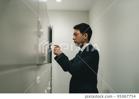 Office workers in lockers and suits Office workers in lockers and suits 95067754