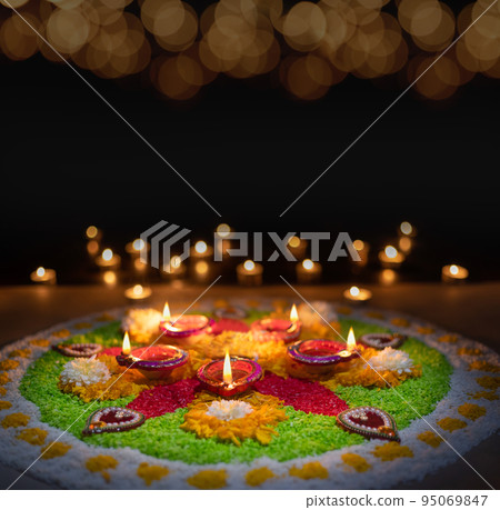 Clay diya lamps lit during diwali celebration, Diwali, or Dipawali, is India's biggest and most important holiday.. 95069847