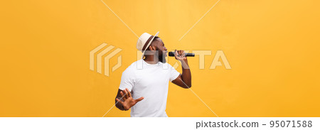 Young teenage black African American boy singer performing at a concert. 95071588