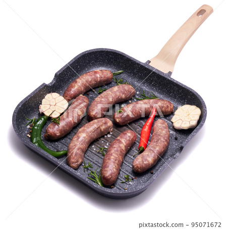 Raw beef or pork grill sausage on grill frying pan isolated on white background 95071672