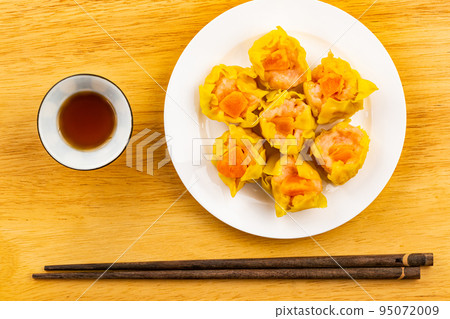 Top view, flat lay fresh delicious homemade shrimp, minced pork and salted egg yolk steamed dumplings. Top view, flat lay fresh delicious homemade shrimp, minced pork and salted egg yolk steamed dumplings. 95072009
