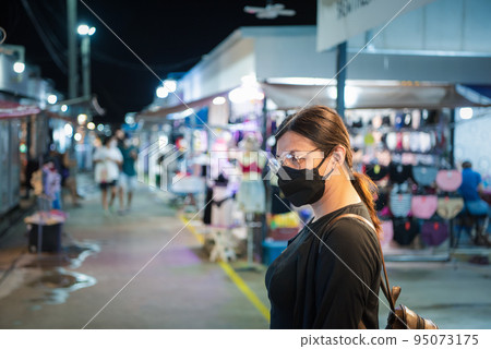 Woman (LGBTQ) posing with food at thai street food 95073175