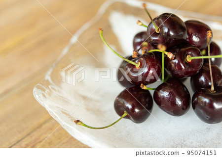 Cherry fresh berry fruit sweet juicy on wood table Cherry fresh berry fruit sweet juicy on wood table 95074151