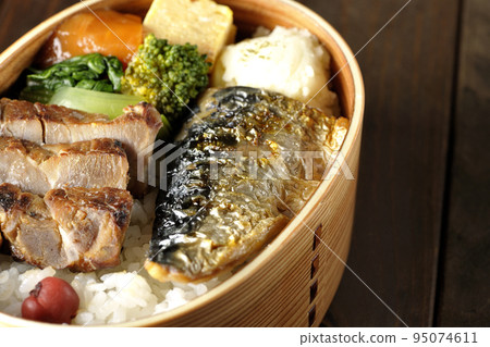 Grilled fish bento box with pork, potato salad, omelet, etc. Grilled fish bento box with pork, potato salad, omelet, etc. 95074611