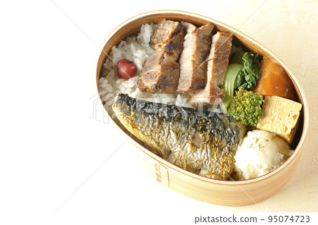A bird's-eye view of a grilled fish bento box containing pork, potato salad, omelet, etc. A bird's-eye view of a grilled fish bento box containing pork, potato salad, omelet, etc. 95074723
