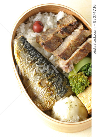 A bird's-eye view of a grilled fish bento box containing pork, potato salad, omelet, etc. A bird's-eye view of a grilled fish bento box containing pork, potato salad, omelet, etc. 95074736