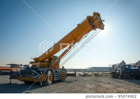 A Track crane working in a industrial construction area 95074982