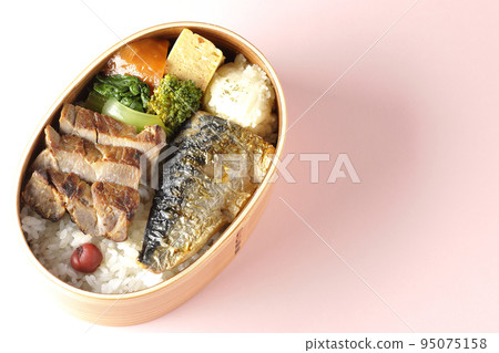 A bird's-eye view of a grilled fish bento box containing pork, potato salad, omelet, etc. A bird's-eye view of a grilled fish bento box containing pork, potato salad, omelet, etc. 95075158