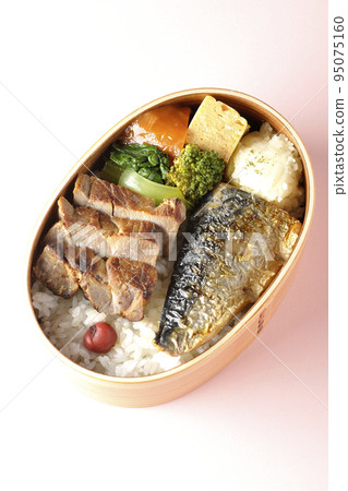 A bird's-eye view of a grilled fish bento box containing pork, potato salad, omelet, etc. A bird's-eye view of a grilled fish bento box containing pork, potato salad, omelet, etc. 95075160