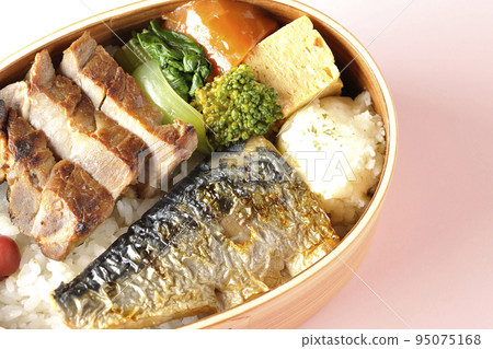 A bird's-eye view of a grilled fish bento box containing pork, potato salad, omelet, etc. A bird's-eye view of a grilled fish bento box containing pork, potato salad, omelet, etc. 95075168