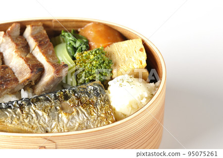 A grilled fish lunch box with pork, potato salad, omelet, etc. in a white background 95075261