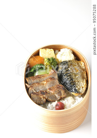 A grilled fish lunch box with pork, potato salad, omelet, etc. in a white background 95075288