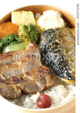 A grilled fish lunch box with pork, potato salad, omelet, etc. in a white background 95075290
