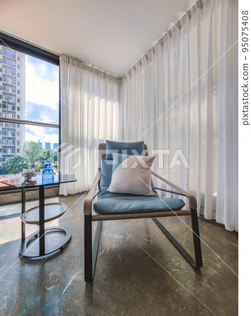 Deck chairs and table on balcony in modern showroom Deck chairs and table on balcony in modern showroom 95075408