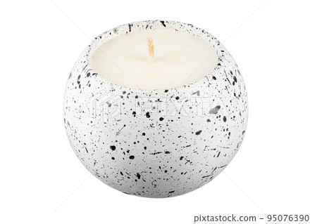 Candle in a concrete candlestick on a white background. Candle in a concrete candlestick on a white background. 95076390