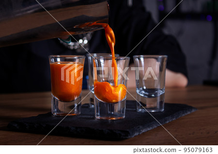 Luxury alcoholic cocktails shots with edibe glitter. 95079163