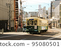 Nagasaki streetcar and cityscape 95080501