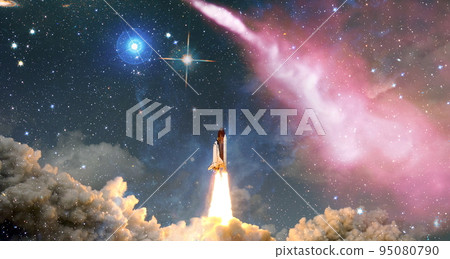 rockets launch into space on the starry sky. spacecraft flies into space with clouds of smoke. Elements of this image furnished by NASA 95080790