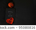 Pumpkin for Halloween notepad with inscription and orange coffee pot place for text black background trick or treat 95080816