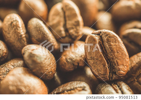 Roasted coffee beans closeup background Roasted coffee beans closeup background 95081513