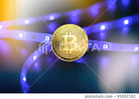 Cryptocurrency concept , Golden bitcoin on mainboard , The future of money. Computational equipment. 95081582