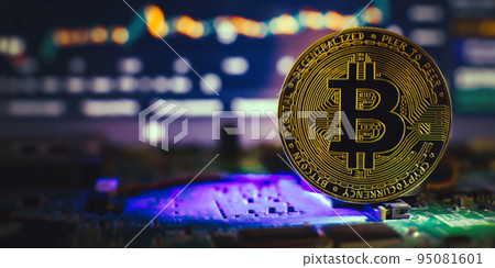 Cryptocurrency concept , Golden bitcoin on mainboard , The future of money. Computational equipment. 95081601