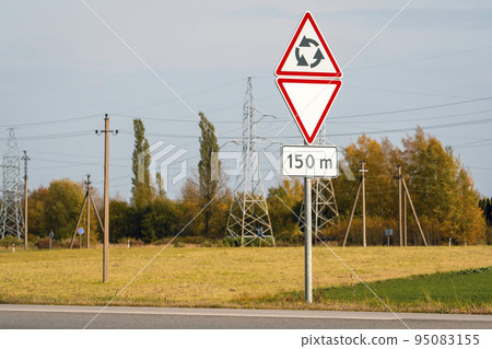 Give way sign at a roundabout Give way sign at a roundabout 95083155