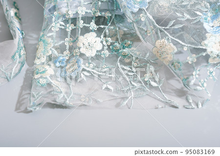 details of glamour shiny lace dress with sequins and hand made embroidery. floral ornament on wedding or party dress. 95083169