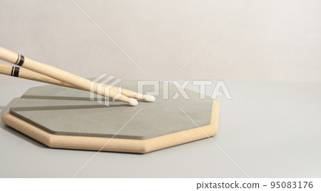 Pair of drumsticks, training pad, practicing for drummers. Copy paste. Music learning concept 95083176