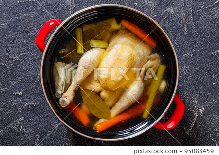 cooked chicken bouillon of whole chicken in pot cooked chicken bouillon of whole chicken in pot 95083459