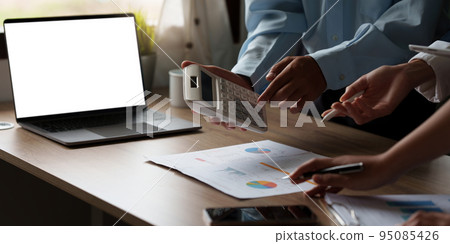 Business and partnership discussing using calculator to review balance sheet and calculating budget. audit integrity before investment concept 95085426