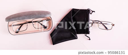 Storage concept - broken glasses in a soft case and whole glasses in a hard case. Top view. Web banner Storage concept - broken glasses in a soft case and whole glasses in a hard case. Top view. Web banner 95086131