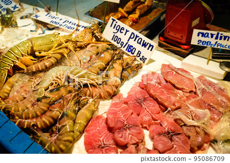 Seafood on ice sell in local fishery night market Seafood on ice sell in local fishery night market 95086709
