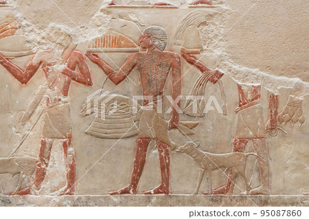 Ancient Egypt stone relief with birds figures and different signs 95087860