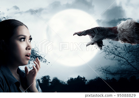 Asian woman scared looking at Werewolf hand Asian woman scared looking at Werewolf hand 95088829