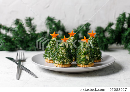 Holiday appetizer in form of christmas tree Holiday appetizer in form of christmas tree 95088927
