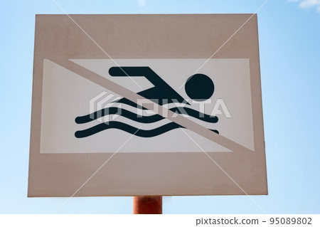 Close up sign of no swimming around the area 95089802