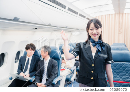 Passengers spending time on board an airplane 95089970