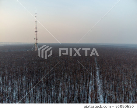 Aerial view winter dark forest with telecom tower Aerial view winter dark forest with telecom tower 95090650