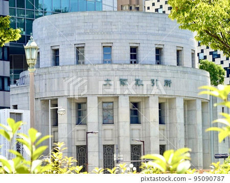 A view of the front entrance of the Osaka Securities Exchange through the greenery of the plantation Kitahama, Chuo-ku, Osaka 95090787