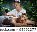 portrait of young beautiful woman in spa environment.   95092277