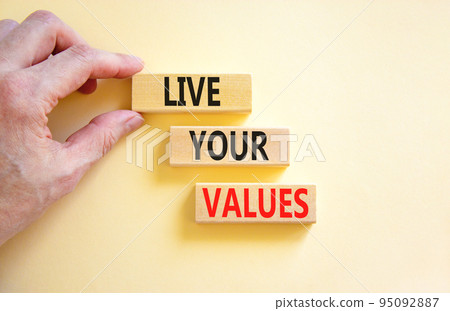 Live your values symbol. Concept words Live your values on wooden blocks. Businessman hand. Beautiful white table white background. Business, psychological and live your values concept. Copy space. Live your values symbol. Concept words Live your values on wooden blocks. Businessman hand. Beautiful white table white background. Business, psychological and live your values concept. Copy space. 95092887