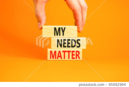 My needs matter symbol. Concept words My needs matter on wooden blocks. Businessman hand. Beautiful orange table orange background. Business, psychological and my needs matter concept. Copy space. 95092904