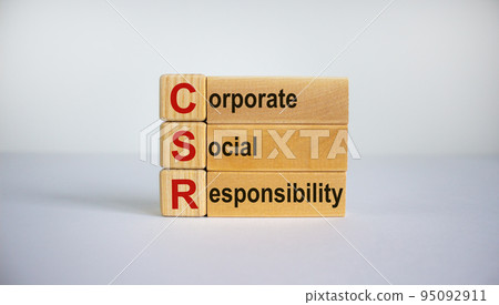 Concept words 'CSR, corporate social responsibility' on cubes and blocks on a beautiful white background. Business concept. Copy space. 95092911