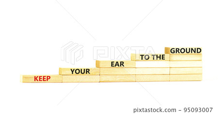 Keep your ear to the ground symbol. Concept words Keep your ear on the ground on wooden blocks. Beautiful white table white background. Business keep your ear on the ground concept. Copy space. Keep your ear to the ground symbol. Concept words Keep your ear on the ground on wooden blocks. Beautiful white table white background. Business keep your ear on the ground concept. Copy space. 95093007