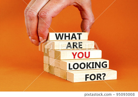 What are you looking for symbol. Concept words What are you looking for on wooden blocks. Businessman hand. Beautiful orange background. Business what are you looking for concept. Copy space. What are you looking for symbol. Concept words What are you looking for on wooden blocks. Businessman hand. Beautiful orange background. Business what are you looking for concept. Copy space. 95093008