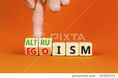 Altruism or egoism symbol. Concept words Egoism and Altruism on wooden cubes. Psychologist hand. Beautiful orange table orange background. Business psychological altruism or egoism concept. Copy space Altruism or egoism symbol. Concept words Egoism and Altruism on wooden cubes. Psychologist hand. Beautiful orange table orange background. Business psychological altruism or egoism concept. Copy space 95093019