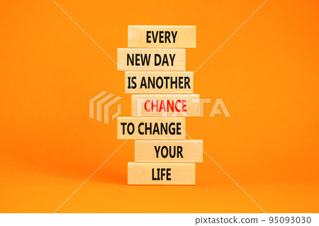 Chance to change symbol. Concept words Every new day is another chance to change your life on blocks on a beautiful orange table orange background. Business motivational and chance concept. 95093030