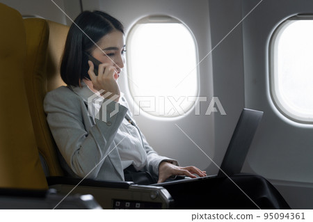 Fund investment woman confirm meeting to client before flight take off. working and travel concept Fund investment woman confirm meeting to client before flight take off. working and travel concept 95094361