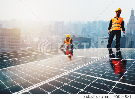 Workers assemble energy system with solar panel for electricity Workers assemble energy system with solar panel for electricity 95094981